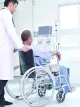 Man in wheelchair with HCP in dialysis ward