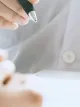 Close-up of a doctor taking notes during a patient consultation