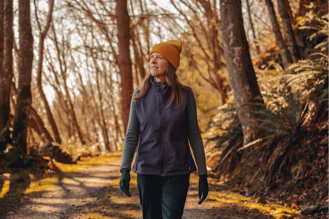 Woman walking in forest