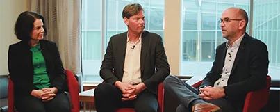 Three panelists seated side by side